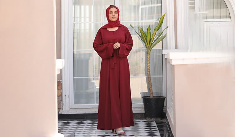 cherry maroon abaya is weared by woman